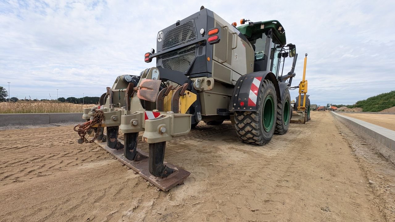 Large construction equipment working on a road in Werlte, Germany, during daytime.